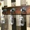 Rustic farmhouse vanity light with reclaimed wood and mason jars
