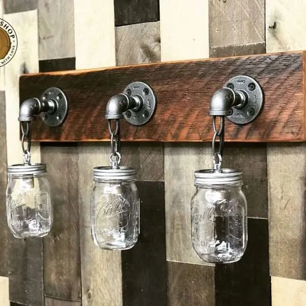 Rustic farmhouse vanity light with reclaimed wood and mason jars
