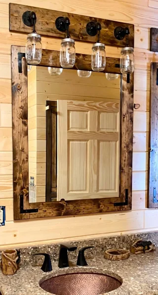 Horizontal rustic wood bathroom mirror above a vanity