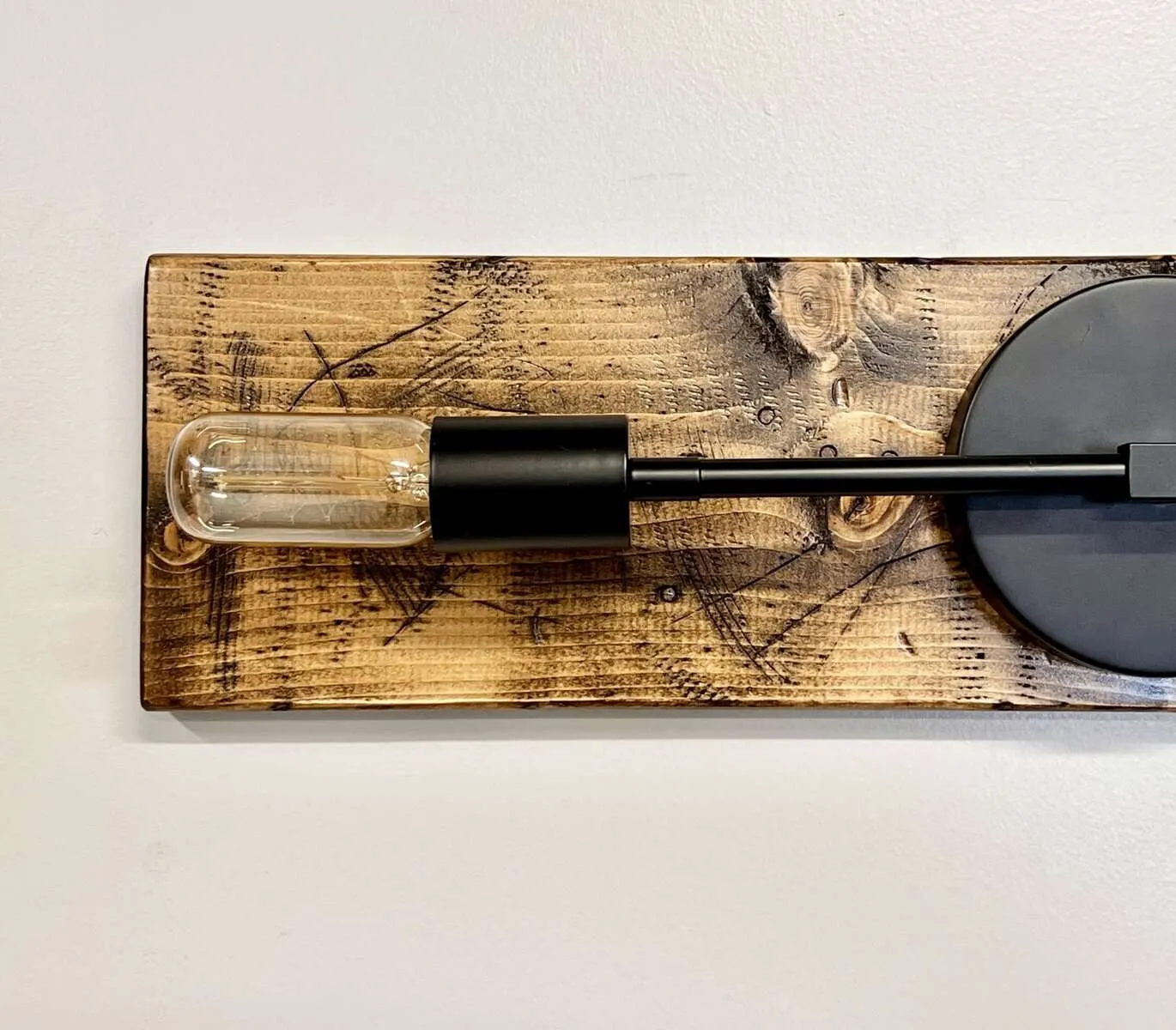 Wall-mounted edison light fixture with wood