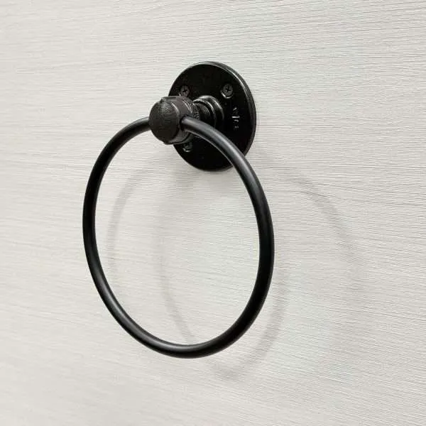 Black towel ring on wall