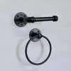 Black towel holder on wall and toilet paper holder set