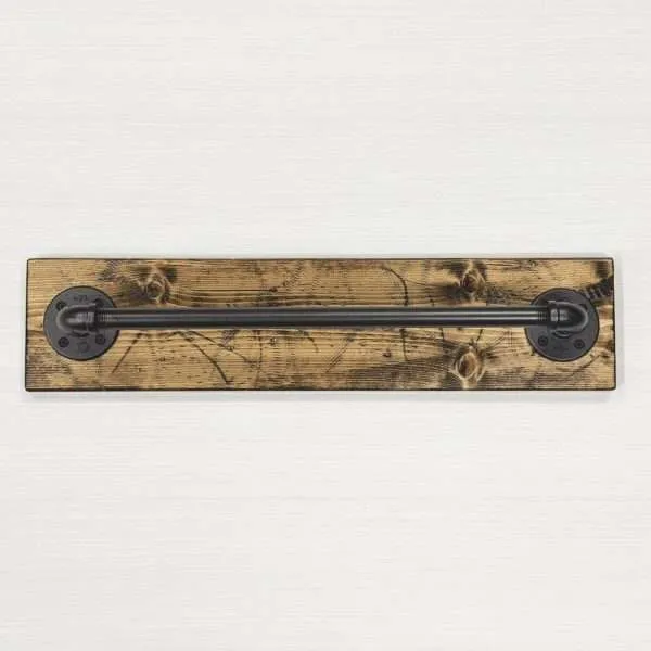 Rustic pipe towel bar handmade in Illinois, USA using solid wood and durable black metal hardware.