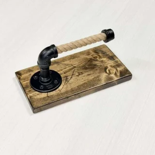 Rustic rope and pipe toilet paper holder on wooden base