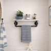 Towel Bar with white shelf above the toilet storage