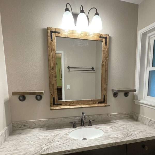 Close up of handcrafted espresso wood grain on a farmhouse mirror frame