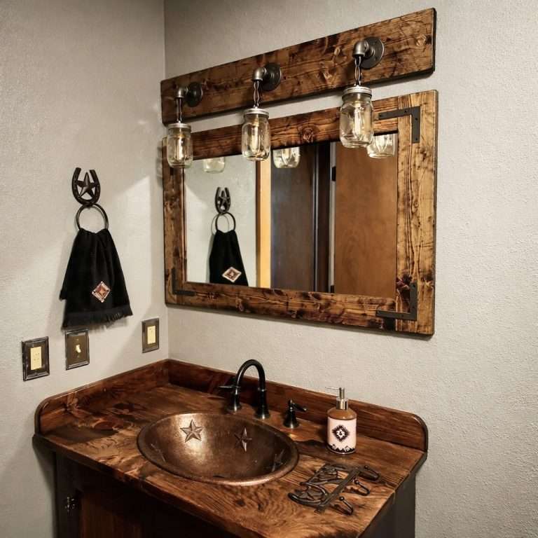 Rustic bathroom mirror with mason jar lights over farmhouse vanity