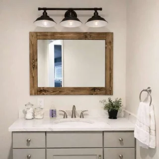 Modern bathroom with wooden mirror