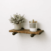 rustic wood shelf on pipe brackets for wall decor
