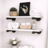 bathroom white shelves sitting above toilet holding towels and flower pot made of solid wood