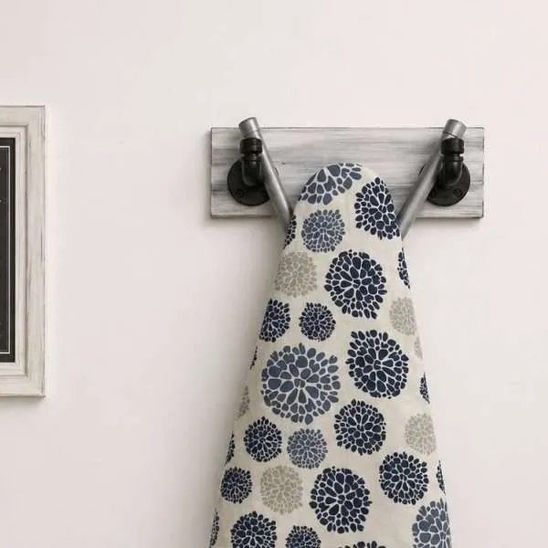 industrial farmhouse ironing board holder wall mount wood and pipe storage