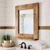 Rustic dark wood framed bathroom mirror with shelf above vanity decor