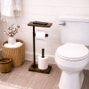 Toilet Paper stand for 3 toilet rolls with shelf and extra storage sitting on the floor next to the toilet in the rustic farmhouse bathroom