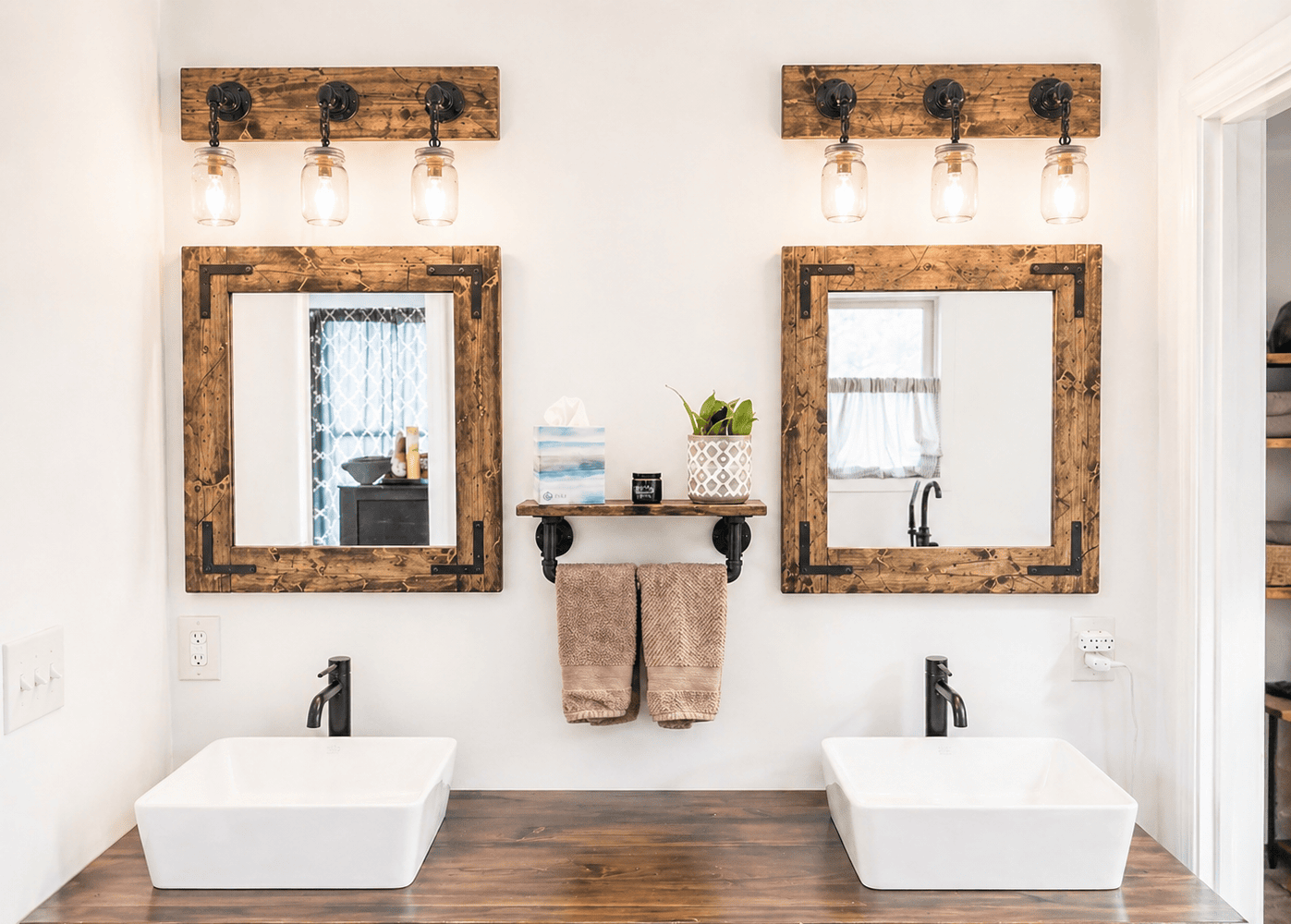 Rustic distressed wood bathroom mirror with oil rubbed bronze corner brackets