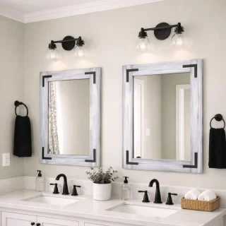 gray whitewash wood frame mirror sitting above a double white vanity in a farmhouse bathroom