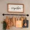 black wall kitchen rack for hanging wood boards or towel in a bathroom