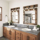 Rustic wood framed bathroom mirror with three-jar vanity light